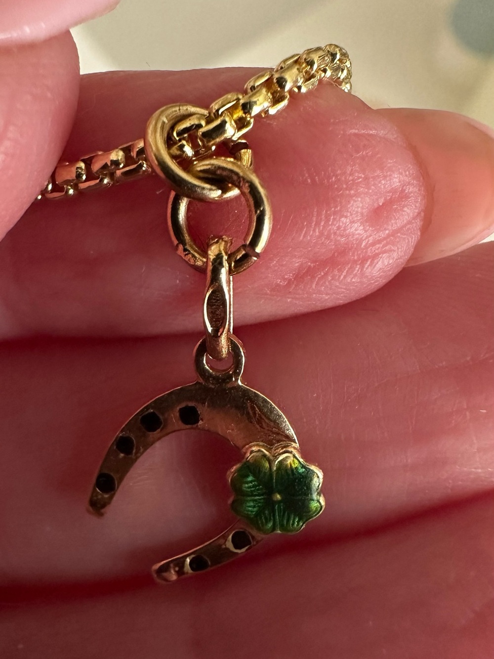 Vintage Italian 18k gold horseshoe charm with green enamel clover